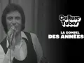 Un chanteur d'un groupe hollandais des années 70, micro en main, sur fond de rideaux. Texte "Culture Tubes" et "La compil des années 70".