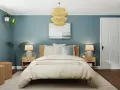 Habitación con paredes azul petróleo, cama acogedora y detalles en madera. Ideas de colores para habitaciones que inspiran calma y serenidad.