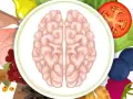 Dieta mind: mózg otoczony zdrowymi produktami jak jagody, pomidor, brokuły, fasola i mięso.