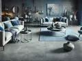 Nowoczesny salon z szarą podłogą, sofami i niebieskimi dodatkami.