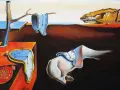 Salvador Dalí "Trwałość pamięci" - surrealistyczny krajobraz z topiącymi się zegarami, symbolem ulotności czasu.