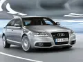 Silberner Audi A6 4F Quattro fährt durch eine beleuchtete Röhre.
