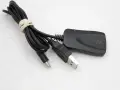 Czarny adapter Wi-Fi z kablem USB i złączem micro USB. Idealny, by dowiedzieć się, jak zrobić smart TV z tradycyjnego telewizora.