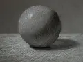 Un detallado dibujo a carboncillo de una esfera, con luces y sombras que le dan volumen. La textura del papel se aprecia en este estudio de esfera.