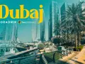 Dubaj: czy do Dubaju trzeba paszport? Widok na nowoczesne drapacze chmur, palmy i przystań z łodziami.
