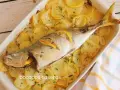 Chicharro al horno con patatas y limón, un plato casero delicioso y saludable.
