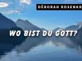 DÉBORAH ROSENKRANZ fragt "Wo bist du Gott?" vor einer majestätischen Bergkulisse am See.