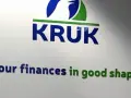 Logo KRUK z hasłem "Your finances in good shape". Firma pomaga w uporządkowaniu zadłużenia.
