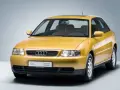 Gelber Audi A3 Baujahr 2000, dreitürig, mit Schiebedach und dem Schriftzug "Audi Tradition".