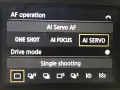 Menu appareil photo : AF operation, AI Servo AF, ONE SHOT, AI FOCUS, AI SERVO. Le mode AI SERVO est sélectionné.