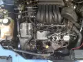 Ford engine bay with labels pointing to the oxygen sensor, AC system, and power steering. This might be related to a p1151 code.