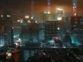 Noche futurista en Night City, con rascacielos iluminados y vehículos voladores. ¿Cuánto dura Cyberpunk 2077? La aventura te espera.