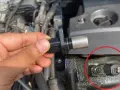 A hand holds a crankshaft position sensor, with a close-up showing the sensor installed. These parts are key to preventing common crankshaft position sensor symptoms like engine stalling.