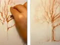 Main gauche estompant un dessin de sanguine d'un arbre nu, créant un effet doux. Un dessin sanguine facile pour un rendu artistique.
