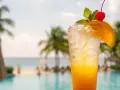 Orzeźwiający drink z pomarańczą i wiśnią, idealny na wakacje. Poznaj przepis na Sex on the Beach i poczuj smak lata!