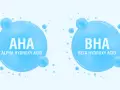 Dwa bąbelki z napisem AHA (Alpha Hydroxy Acid) i BHA (Beta Hydroxy Acid), symbolizujące składniki kosmetyków.