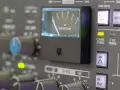 Regler und VU-Meter eines Mischpults, das die analoge Welt der Musikproduktion zeigt.