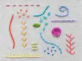 Ejemplos de puntadas de bordado sobre tela: líneas, puntos, espirales y una flor. Son dibujos bordar sobre lana.