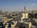 St. Peter's Church in Jaffa, Israel, a city with deep roots in the bible, overlooks the Mediterranean Sea and a modern skyline.