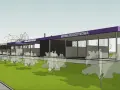 Nowa myjnia bezdotykowa z fioletowym dachem, otoczona drzewami, z widoczną odległością od budynku mieszkalnego.