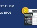 Calculadora y moneda dorada junto a un documento de "TAXES". Averigua cuanto es el IGIC en Canarias y sus tipos.
