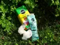 Miracle-Gro plant food and feeder refill packet lie on grass. While not inherently toxic, proper use is key to avoid harming plants.