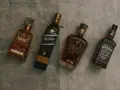 Cztery butelki alkoholi: 1800 Reposado, Johnnie Walker Blue Label, Johnnie Walker XR 21 i Jack Daniel's Red Dog Saloon. Czy to whisky czy whiskey?