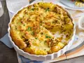 Herzhafte Kartoffel-Quiche mit geschmolzenem Käse und frischer Petersilie, ein Genuss für jeden Tag.