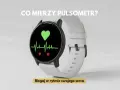 Biały smartwatch z ekranem pokazującym zielone serce i wykres EKG. To idealny test conconiego dla biegaczy.