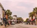 A charming street scene in Beaufort, SC, with palm trees lining the sidewalks and historic buildings. Perfect for exploring all the things to do in Beaufort, SC.