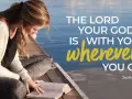 A young woman reads her Bible by the water, finding comfort in trusting God in difficult times with verses like Joshua 1:9.