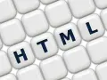 Klawisze z literami H, T, M, L układają się w słowo HTML, symbolizując podstawy programowania.