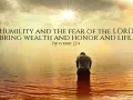 A person kneels in water as the sun shines brightly, illustrating that god lifts up the humble.