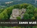 Ruiny zamku Wleń na tle zielonych wzgórz. Jak dojechać do tego malowniczego miejsca?