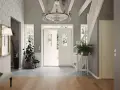 Välkomnande hall med dubbeldörrar, kristallkrona och trappa. Gröna växter ger liv åt det inredda utrymmet.