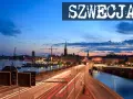Widok na nocny Sztokholm, gdzie widać most z rozmazanymi światłami samochodów, rzekę i zabytkowe budynki. Tak wygląda Szwecja.