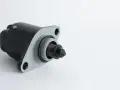 A black and gray idle air control valve, a common cause of rough idling symptoms.