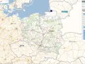 Mapa Polski z zaznaczonymi miastami i drogami. Widoczna warstwa "Ewidencja gruntów i budynków" z numerem ewidencyjnym.