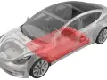 Przekrój Tesli Model 3 z widoczną czerwoną baterią pod podłogą.