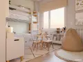 Habitación infantil con litera, ideal para como dividir una habitación para niño y niña. Zona de juegos con mesa y sillas, y un cómodo puf.