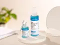 Deux flacons de sérum Aroma-Zone Niacinamide 10% Cuivre & Zinc, pour découvrir les niacinamide bienfaits sur la peau.