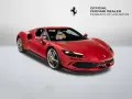 Czerwone Ferrari 296 GTB z beżowym wnętrzem, zaparkowane na białym tle. Obok logo Ferrari i napis "Official Ferrari Dealer Ferrari of Houston".