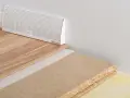 En vit ventilationslist för ett passivt ventilerat golv, med trägolv och byggmaterial.