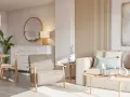 Salón acogedor con sofá y sillón en tonos tierra, mesa de centro de madera y detalles decorativos en colores neutros.