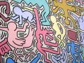 Une fresque colorée de Keith Haring, œuvre la plus connue, avec des figures stylisées dansant et interagissant, un chien jaune, un bébé et une télévision.