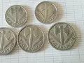 Cinq pièces de 2 francs "État Français" avec une hache et des épis. La valeur pièce de 2 francs 1981 est recherchée par les collectionneurs.