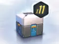Futurystyczna skrzynka z nagrodami (loot box) z symbolem "x11" w tle.