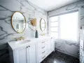 Bagno moderno con marmo, doppio lavabo e rubinetteria oro. Un'idea per capire quanto costa piastrellare un bagno di 5 mq.