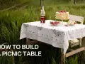 A picnic table set for a sweet treat in a grassy field. Learn how to build a picnic table for your own outdoor gatherings.