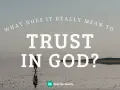 A lone figure walks across a vast, reflective surface, embodying the journey to trust in God.
